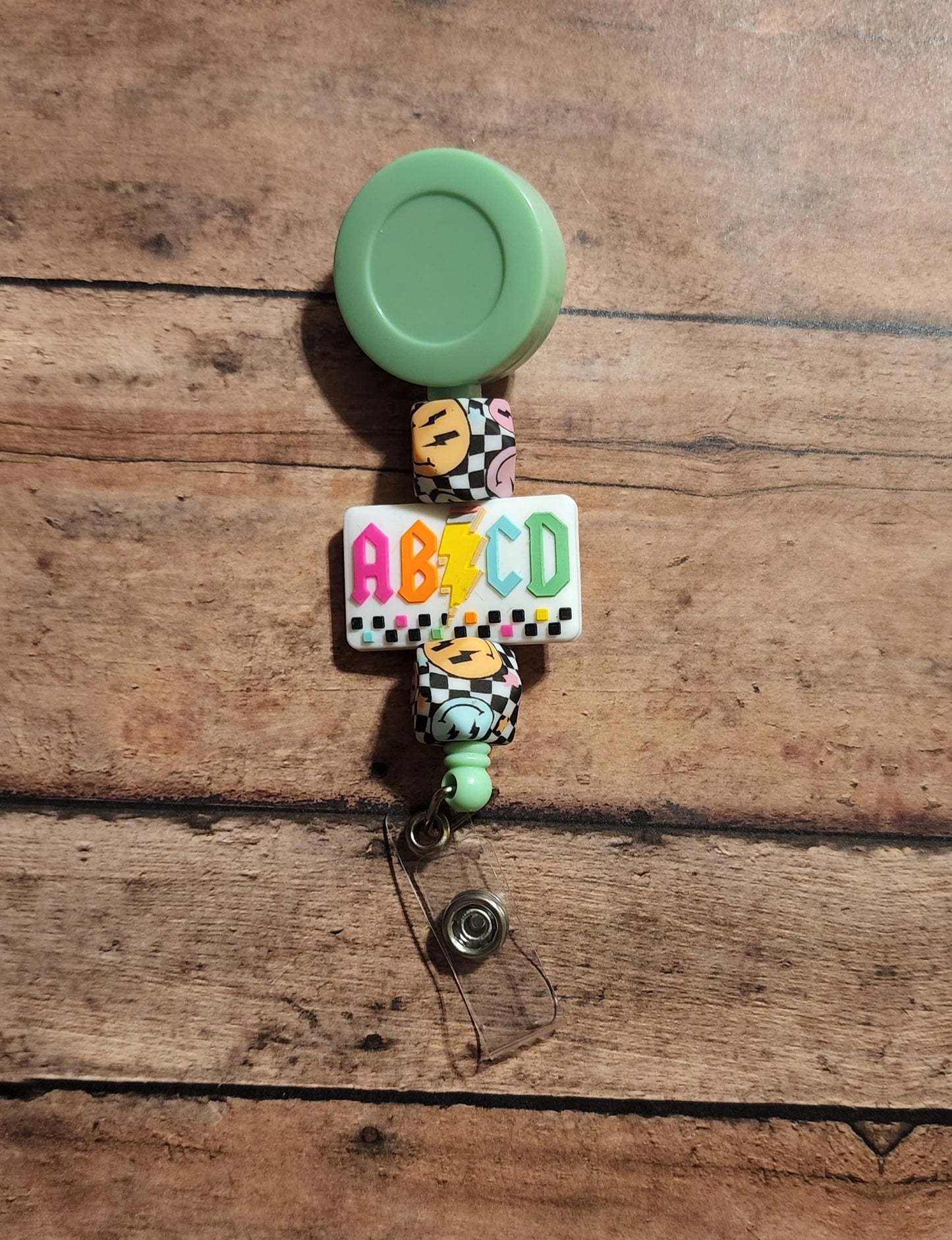 ABCD Bolt Silicone Bead Badge Reel | Checker Smiles Print Badge Reel