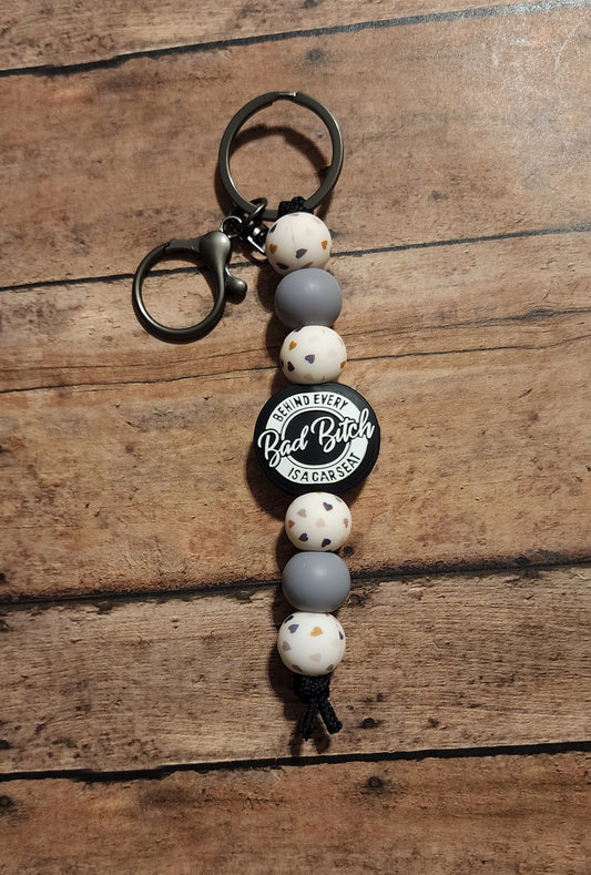 Behind Every Bad Bitch Is a Carseat Hearts Keychain