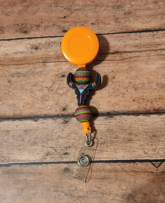 Neon Serape Skull Badge Reel