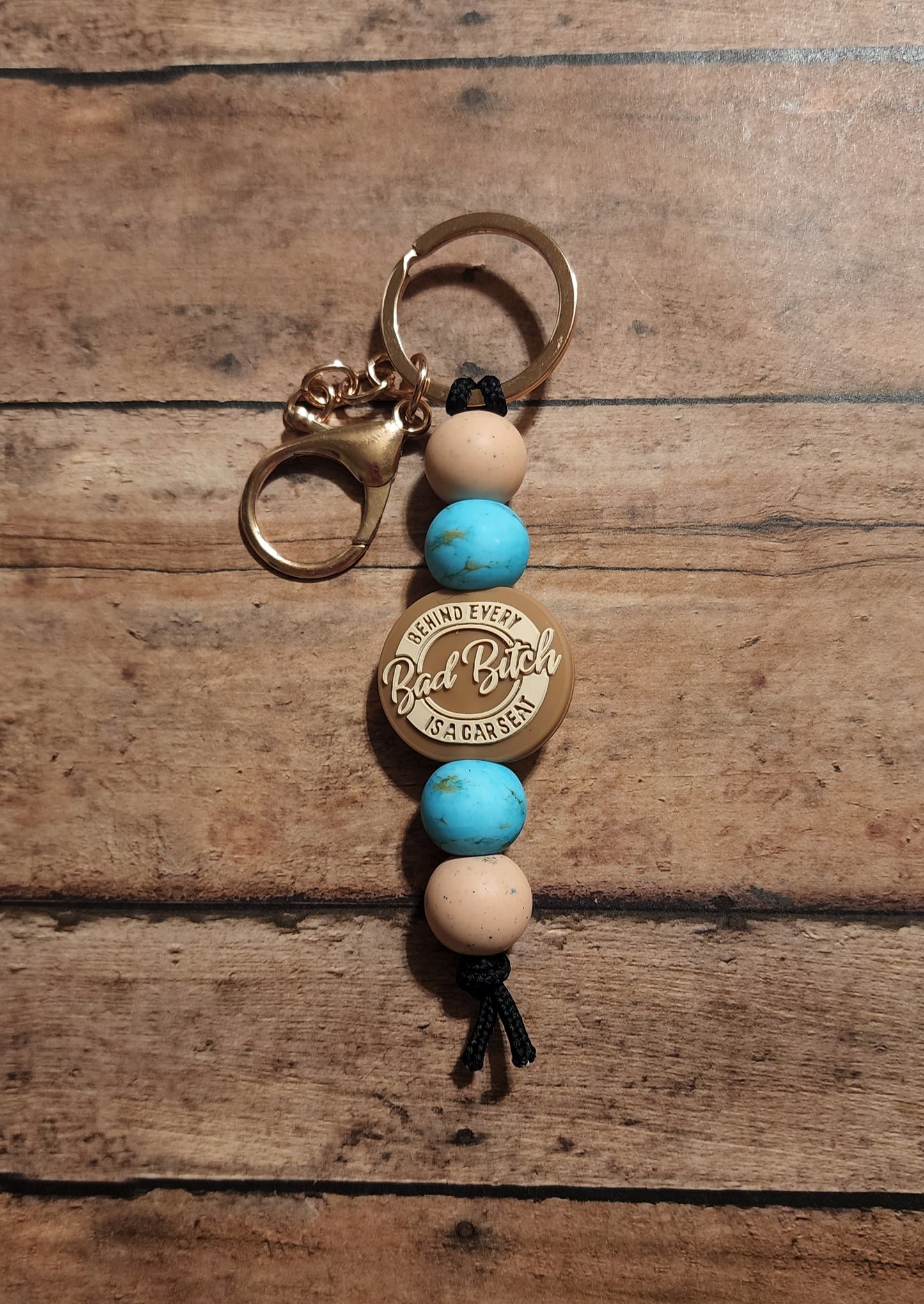Behind Every Bad Bitch Is a Carseat Turquoise/Tan Mini Keychain